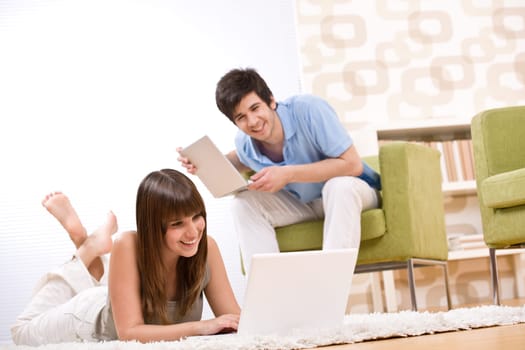 Student - two teenager with laptop in living room
