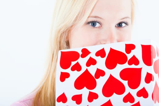 young blond woman with big valentine post card