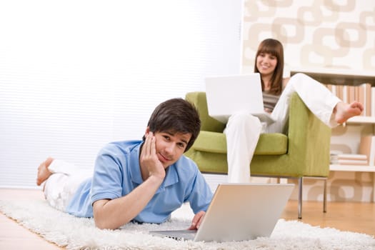 Student - two teenager with laptop in living room