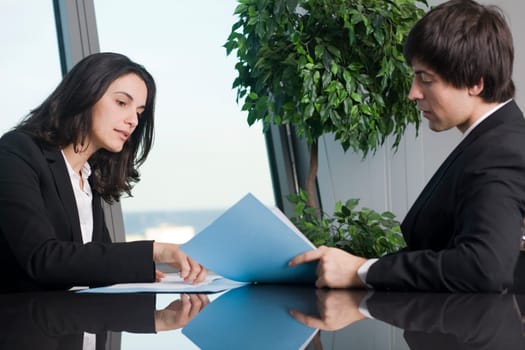 Businesswoman signs paperwork