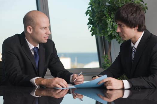 Conversation between two businessmen