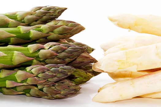 green white asparagus tips opposite each other