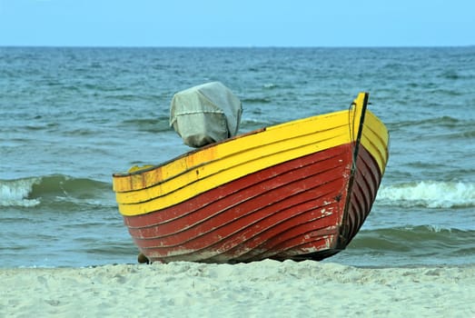 Wooden boat on the seashore