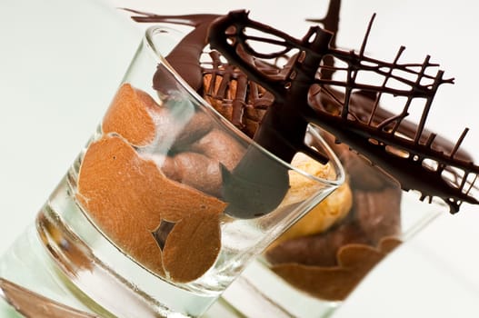 Mousse au chocolat in glass on white background