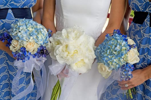 Bride and Two Bridesmaids Holding Bouque
