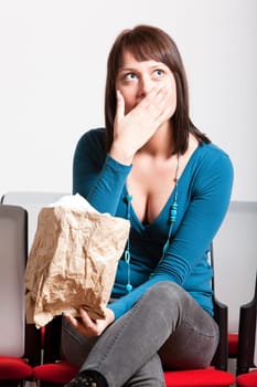sad young woman holding tissue on her face