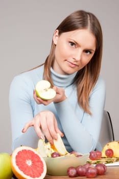 woman with red grapes