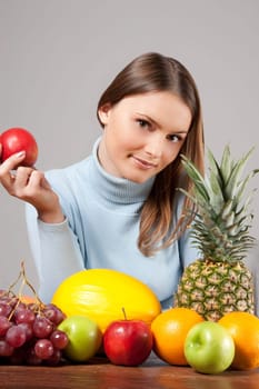 woman with red grapes