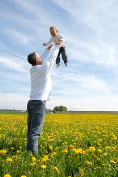Proud father -throwing child up-