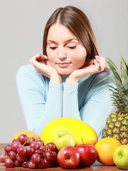 woman with red grapes