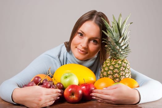 woman with red grapes