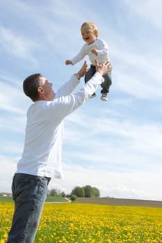 Proud Father - Holding Up Child -