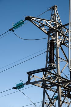 High voltage power lines and blue sky