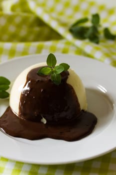 Vanilla pudding with chocolate sauce