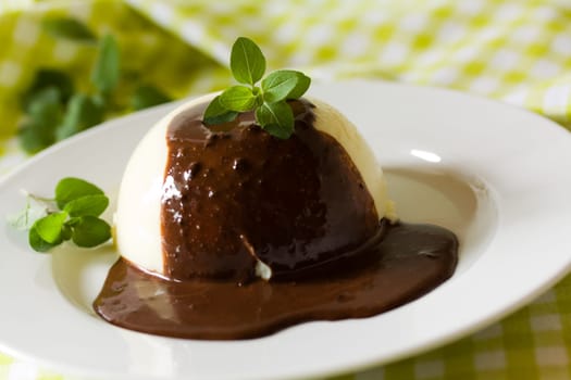 Vanilla pudding with chocolate sauce
