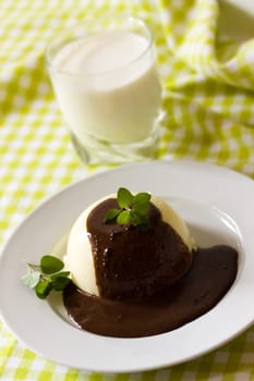 Vanilla pudding with chocolate sauce