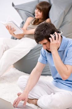 Student - Two teenager with laptop and headphones