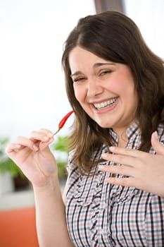 Cook - plus size woman with hot chili pepper