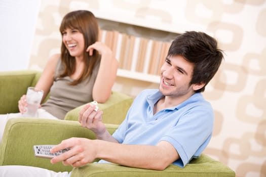 Student - happy teenagers watching television