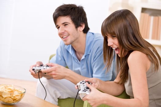 Student - happy teenagers playing video game