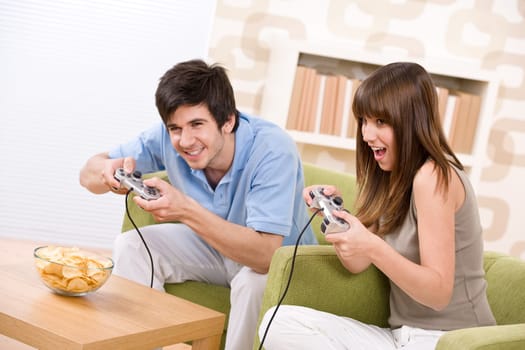 Student - happy teenagers playing video game