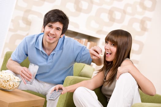 Student - happy teenagers watching television