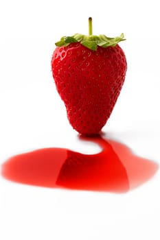 a strawberry on syrup