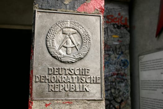 GDR plaque in front of Checkpoint Charlie