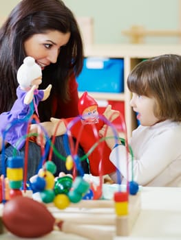 three little girls and female teacher in