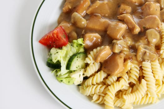 Goulash with noodles and side salad