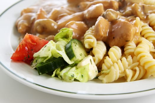 Goulash with noodles and side salad