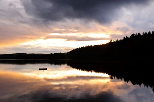 Lake sunset over forest