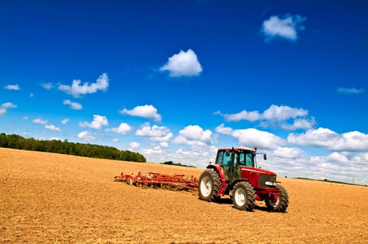 Tractor in plowed field
