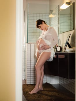 pregnant woman drinking water