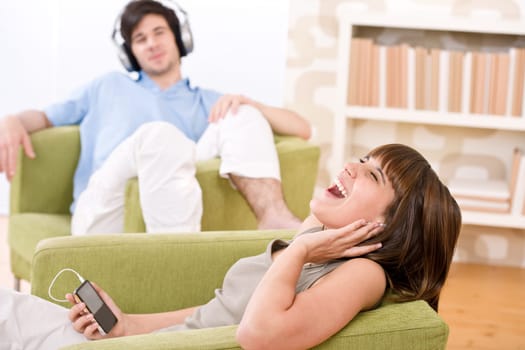 Student - Happy teenagers listen to music enjoying