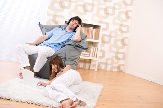 Student - two teenager with laptop in living room