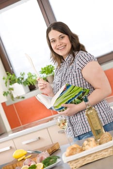 Cook - plus size woman prepare fish with white wine
