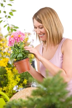 Gardening -  woman holding flower pot with flower