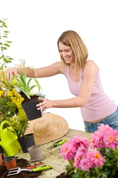 Gardening -  woman holding flower pot with flower