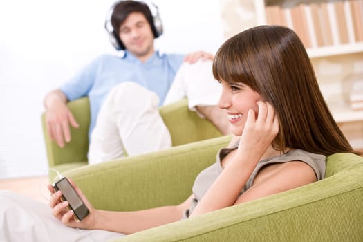 Student - Happy teenagers listen to music
