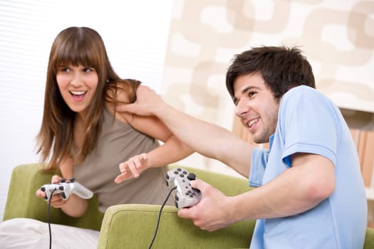 Student - happy teenagers playing video game