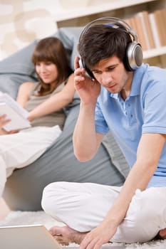 Student - Happy teenager with laptop and headphones