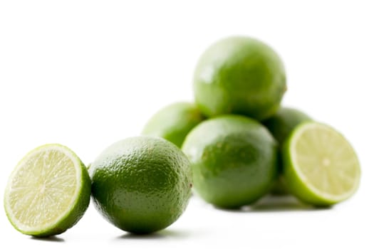 Half and whole lime and others in the background