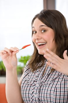 Cook - plus size woman with hot chili pepper