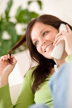 On the phone home Smiling woman calling