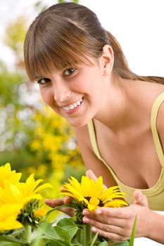 Gardening - portrait of woman with sunflower