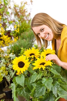 Gardening - portrait of woman with sunflowers