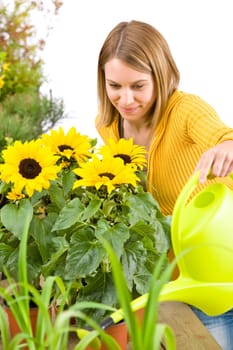 Gardening - woman pouring flowers