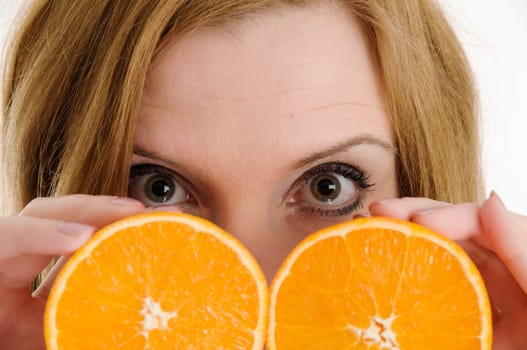 open eyes behind the oranges