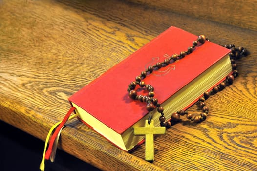 Hymnal book and wooden rosary bead- detail